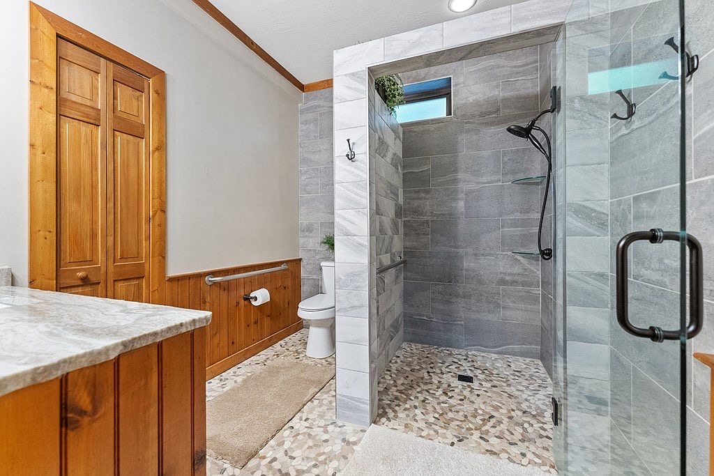 En suite bath w/ walk in shower, private to the king bedroom on the main level