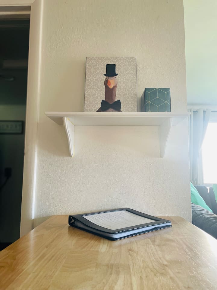 A printed welcome guide is ready on the table, offering helpful information for you and your travel companions.