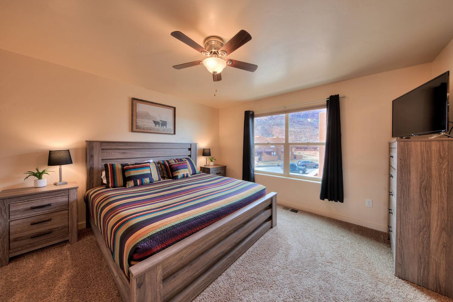 Bedroom 2 with dresser and TV