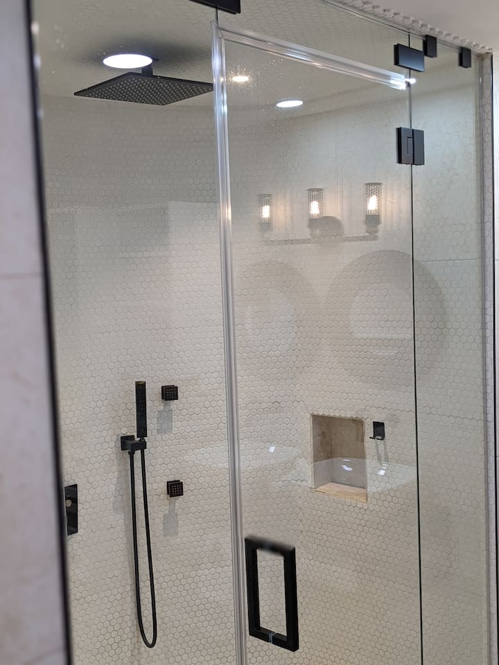 Kind of hard to tell from this pic, but this primary shower has a semi circle shape. This was my idea(Chris) and lets just say Tamara(my wife) thought(thinks) I was crazy:) It works great! 12 inch rainshower head, 4 jets, and steam. Delightfull. 