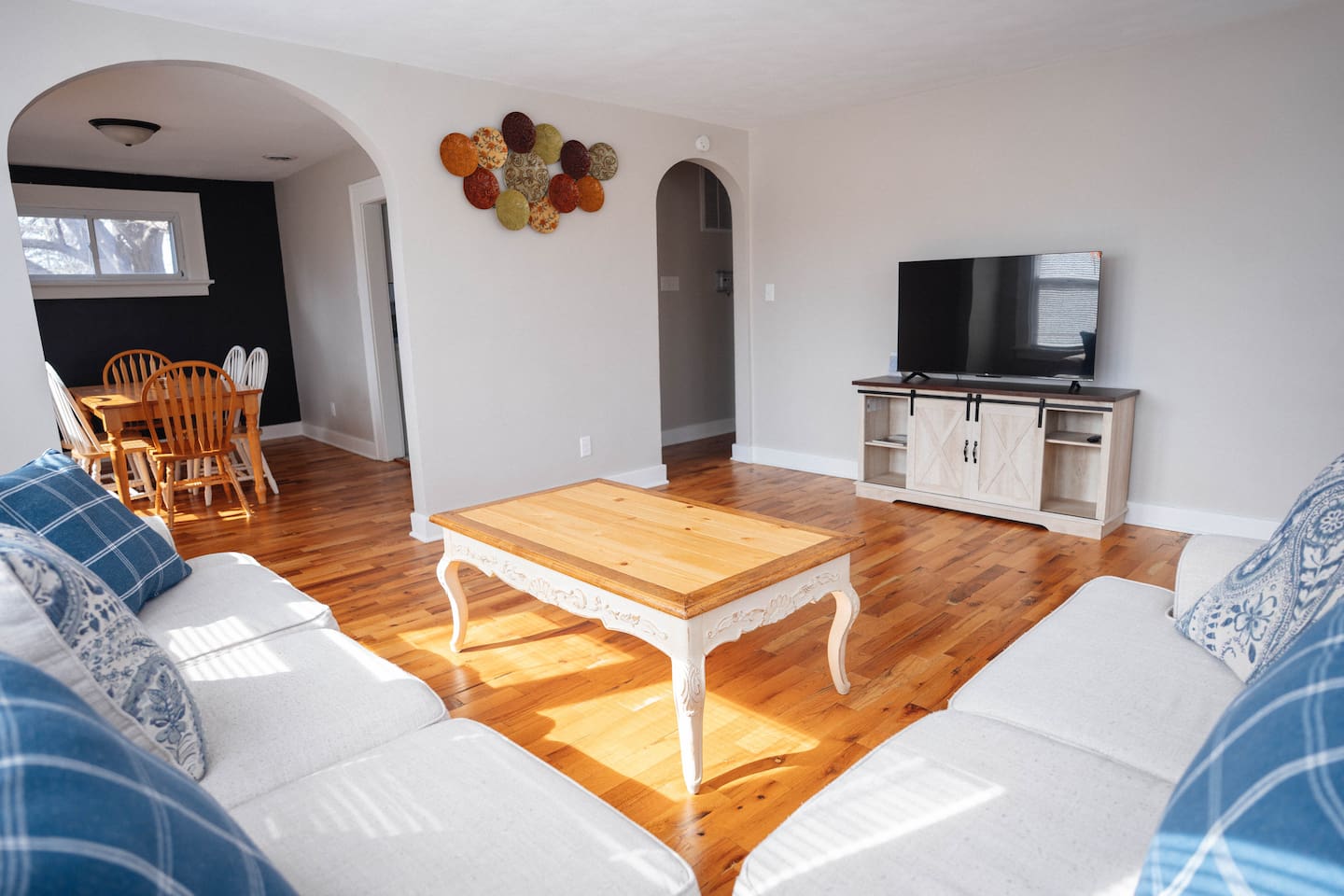 Kick back on the comfy couch, put your feet up on the coffee table, and enjoy your favorite shows on the smart TV. It’s a great spot to relax, hang out, and unwind after a long day.