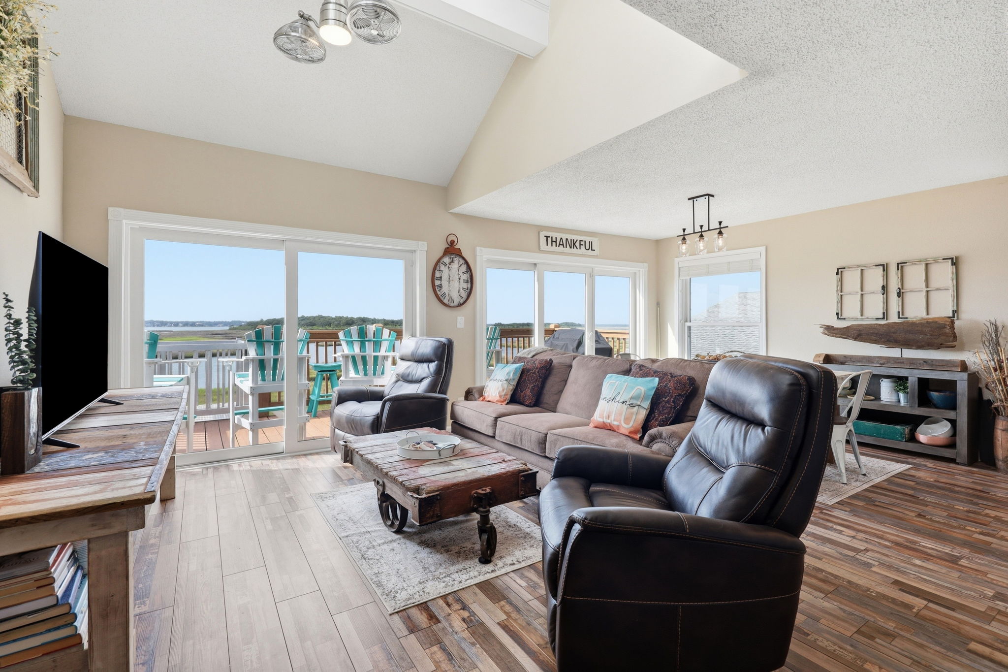 Sink into comfort after a day of beach adventures. This spacious living area offers comfortable seating for everyone