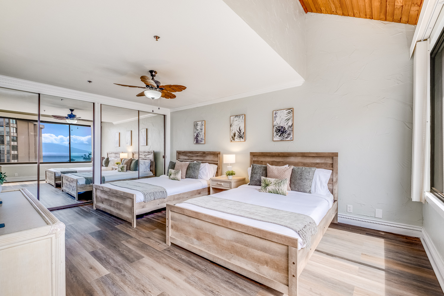 Second bedroom on the lower level. Two plush queen beds and another spectacular Pacific view, with a dual-sink bathroom and separate shower area.