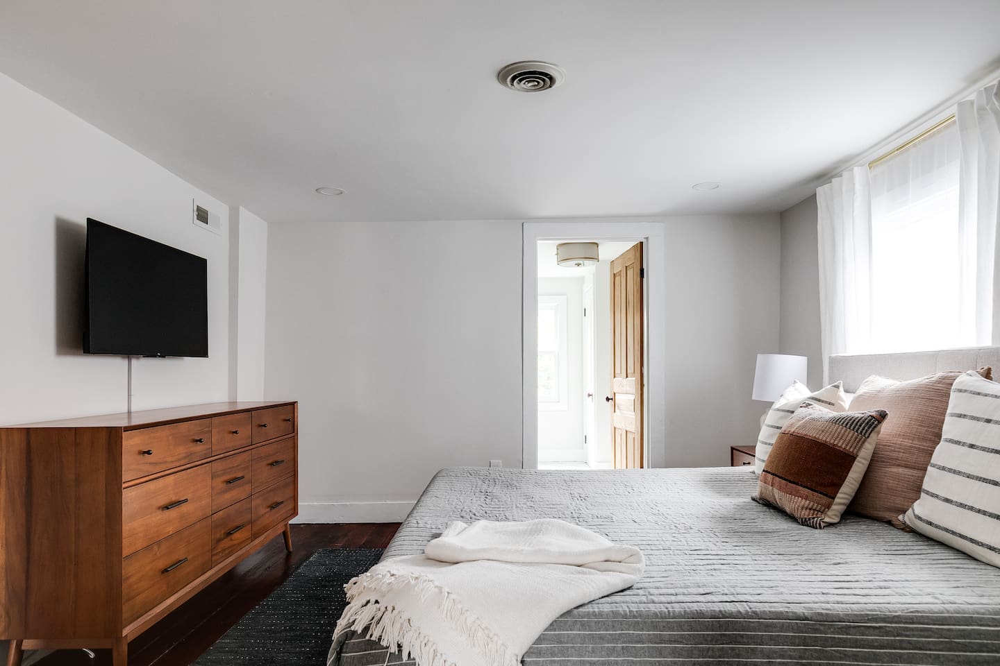Second Floor King Bedroom: Bright space with a king bed, sleek decor, and a modern TV for entertainment!