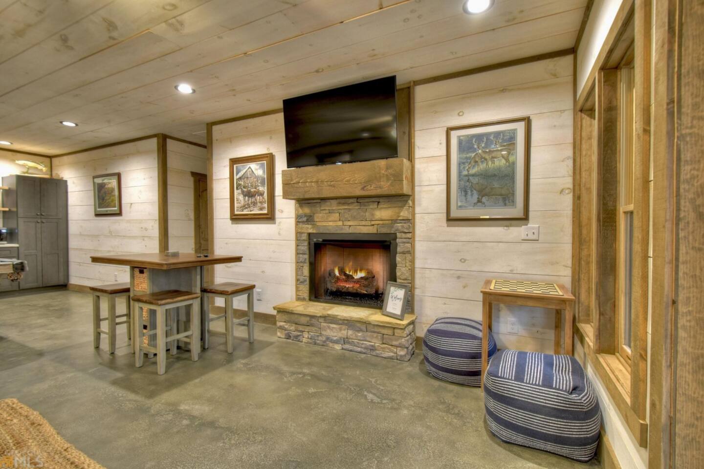 Remote control fireplace in the game room.