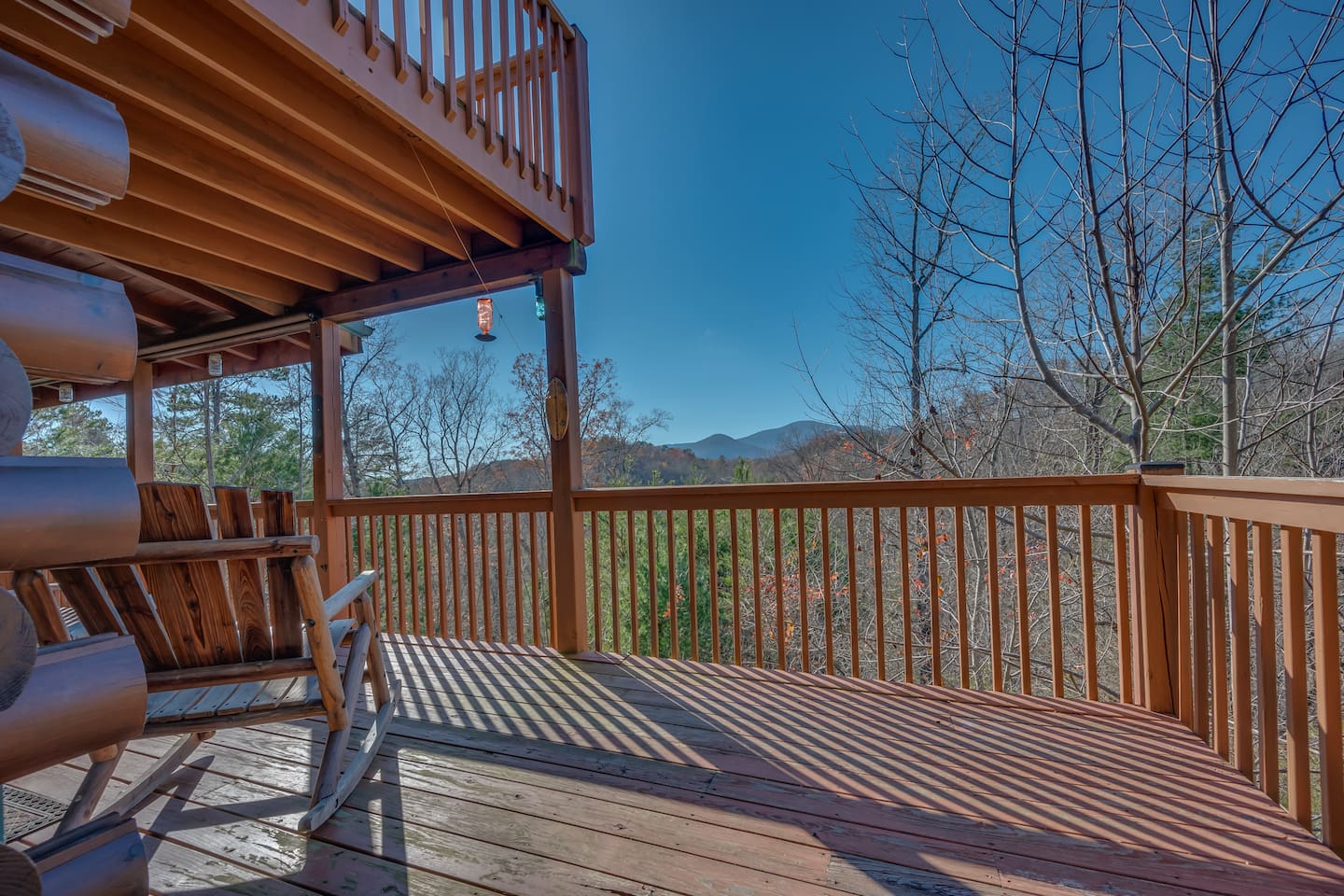 Main level deck of home with views