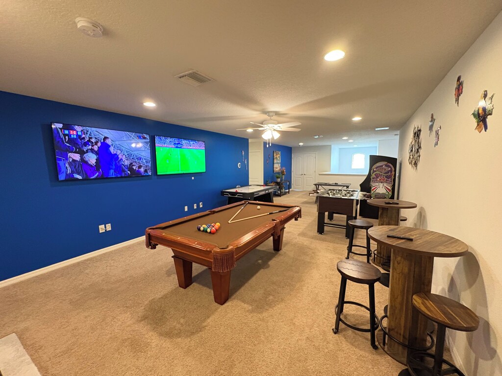 Grab a cold one from the wet bar and watch the GAMES from a comfy bar stool