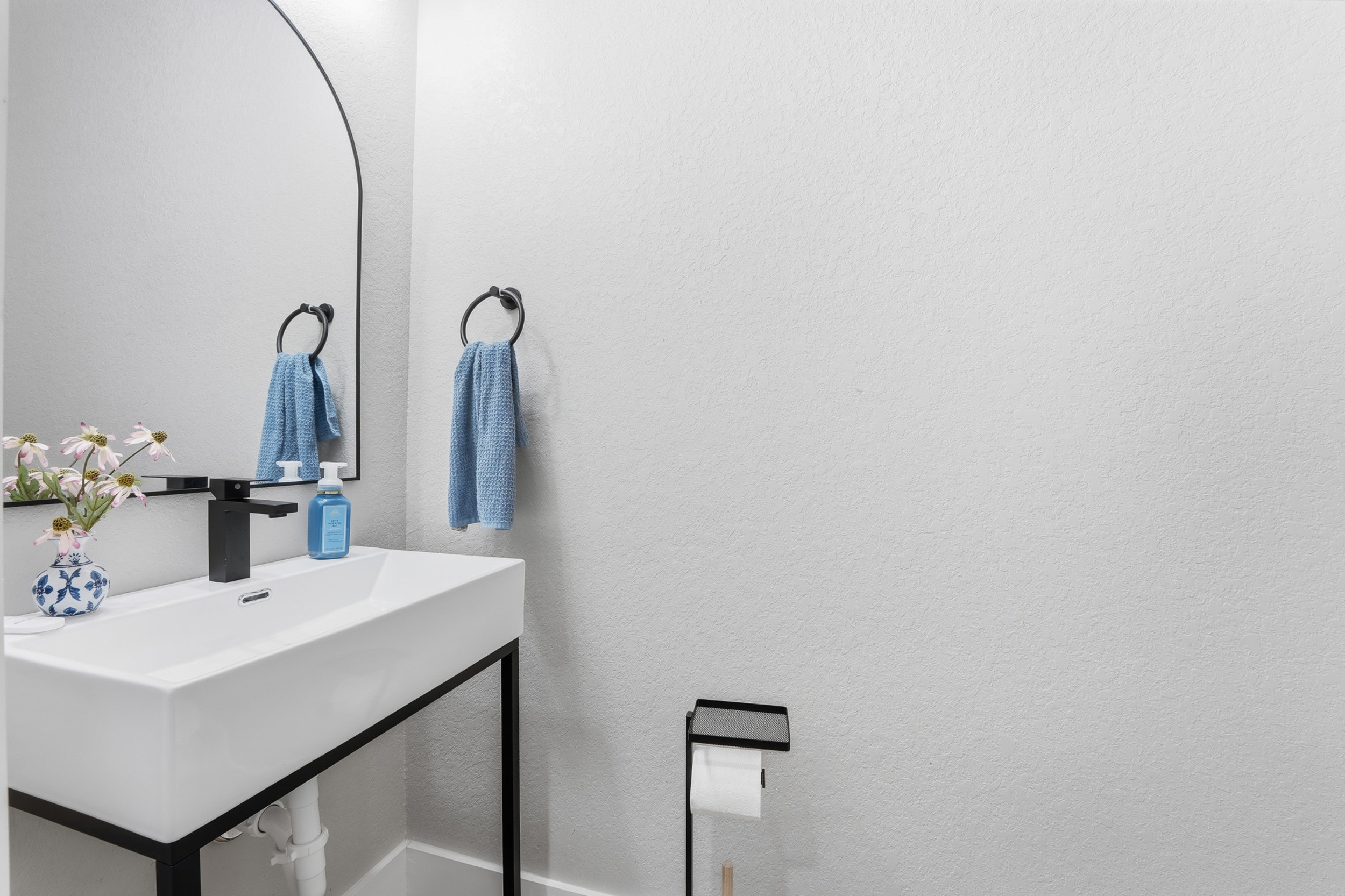 Convenient half bath located off the main living area.