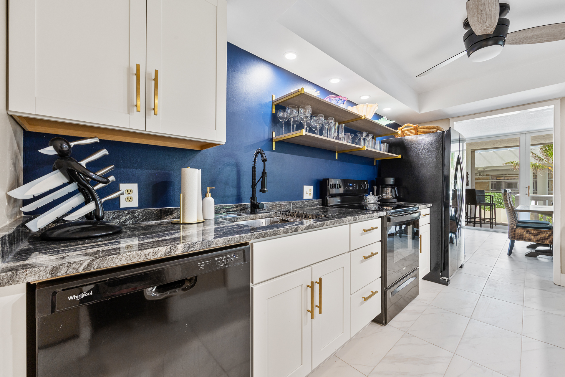 Fully stocked kitchen with cookware, plates, utensils, and all your dining essentials — plus a refrigerator with built-in ice maker and water filter.