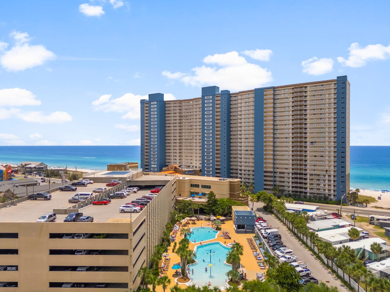 Enjoy two resort-style pools, a relaxing hot tub, a fun splash area, and a shallow kids' pool—perfect for family-friendly fun just steps from the sand!