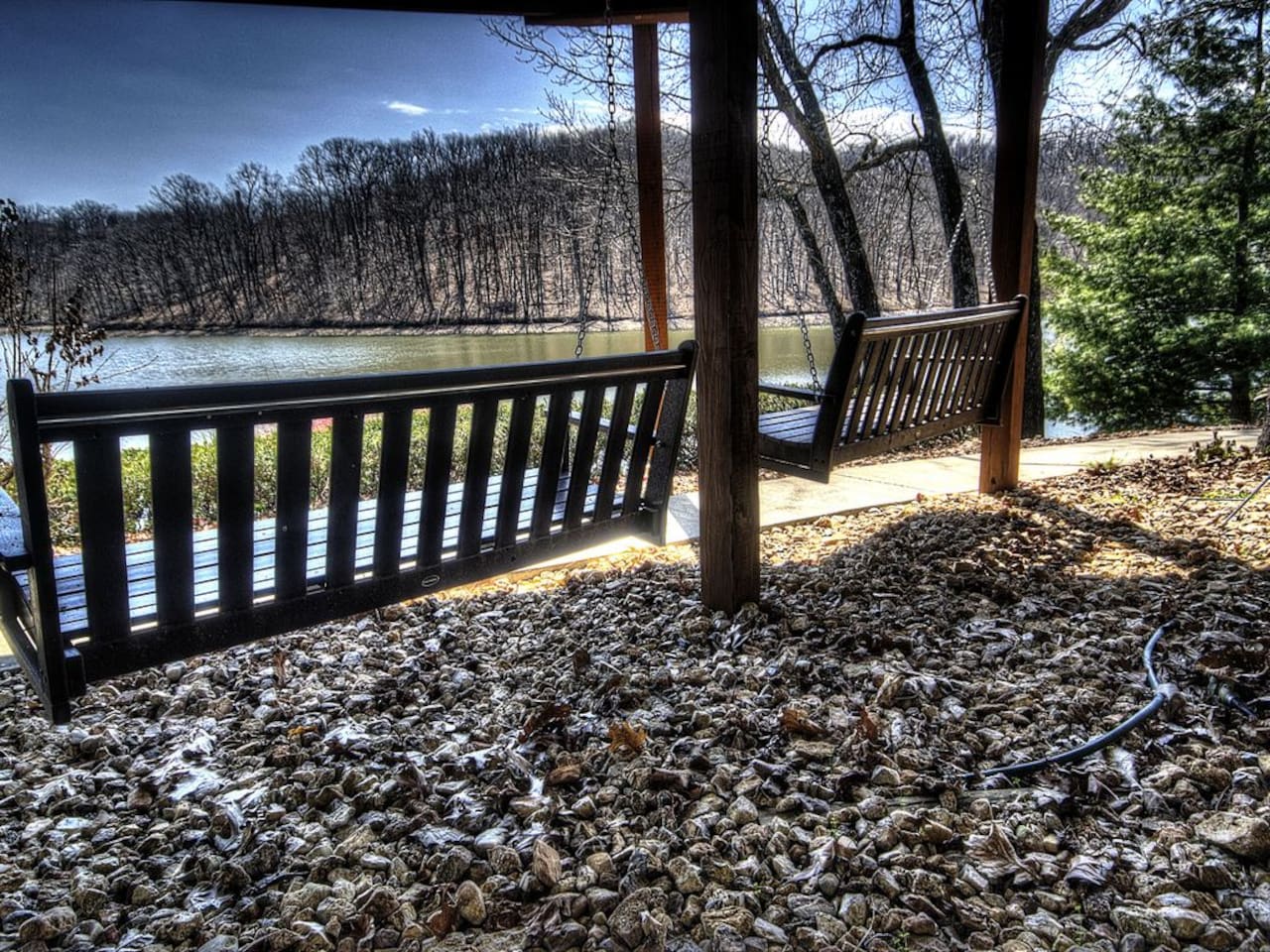 Shaded lake side porch swings