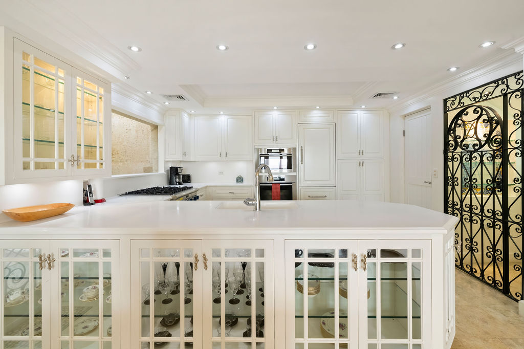Fully stocked kitchen with a wine grotto 