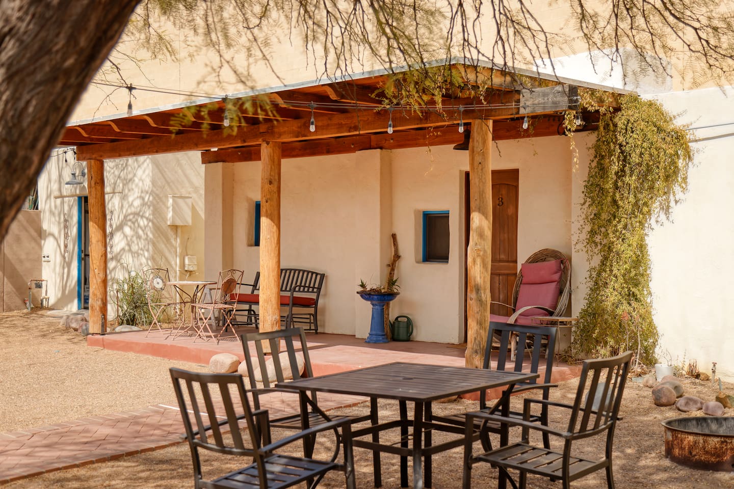 Outside dining area with grill and fire pit