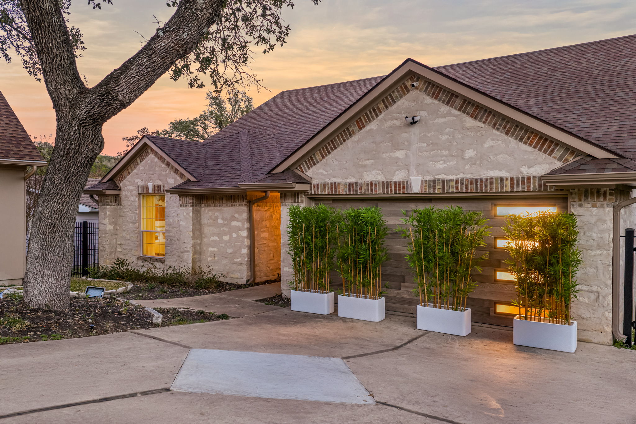 Beautiful front exterior with warm evening lighting and great curb appeal.