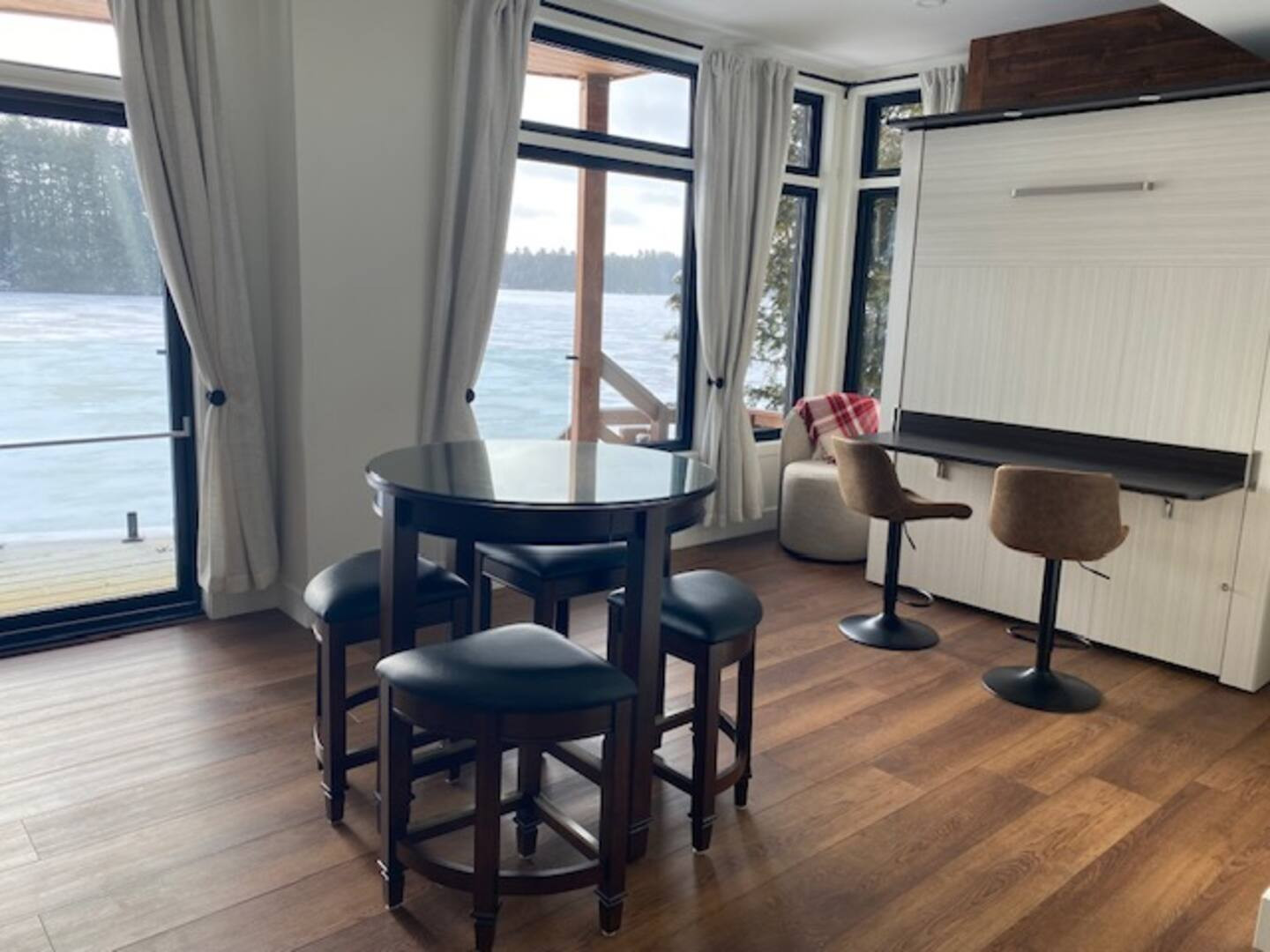 Bedroom 3 showing Queen murphy bed stored in wall with Workspace area on bed back