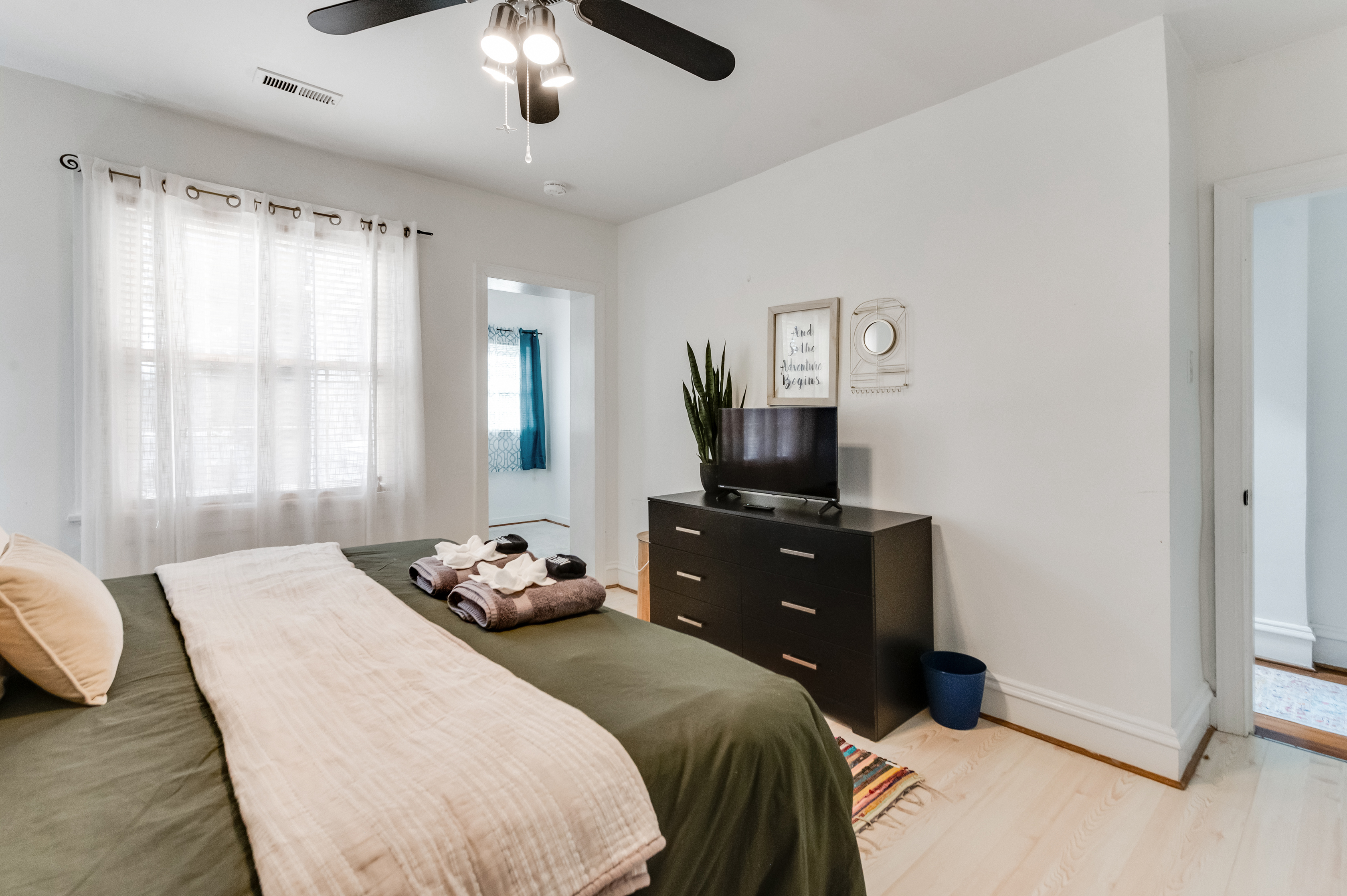 King Bedroom 1: Bright and airy oasis with stylish decor and a comfy king bed for ultimate relaxation!