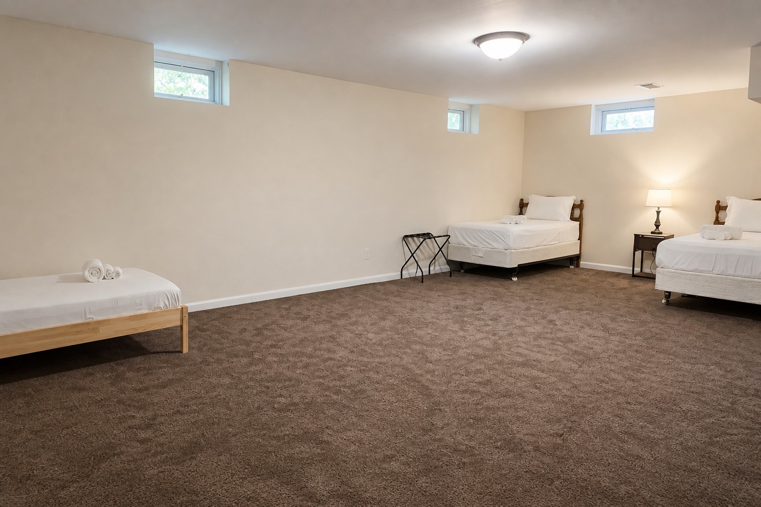 Lower-level bedroom with three single beds