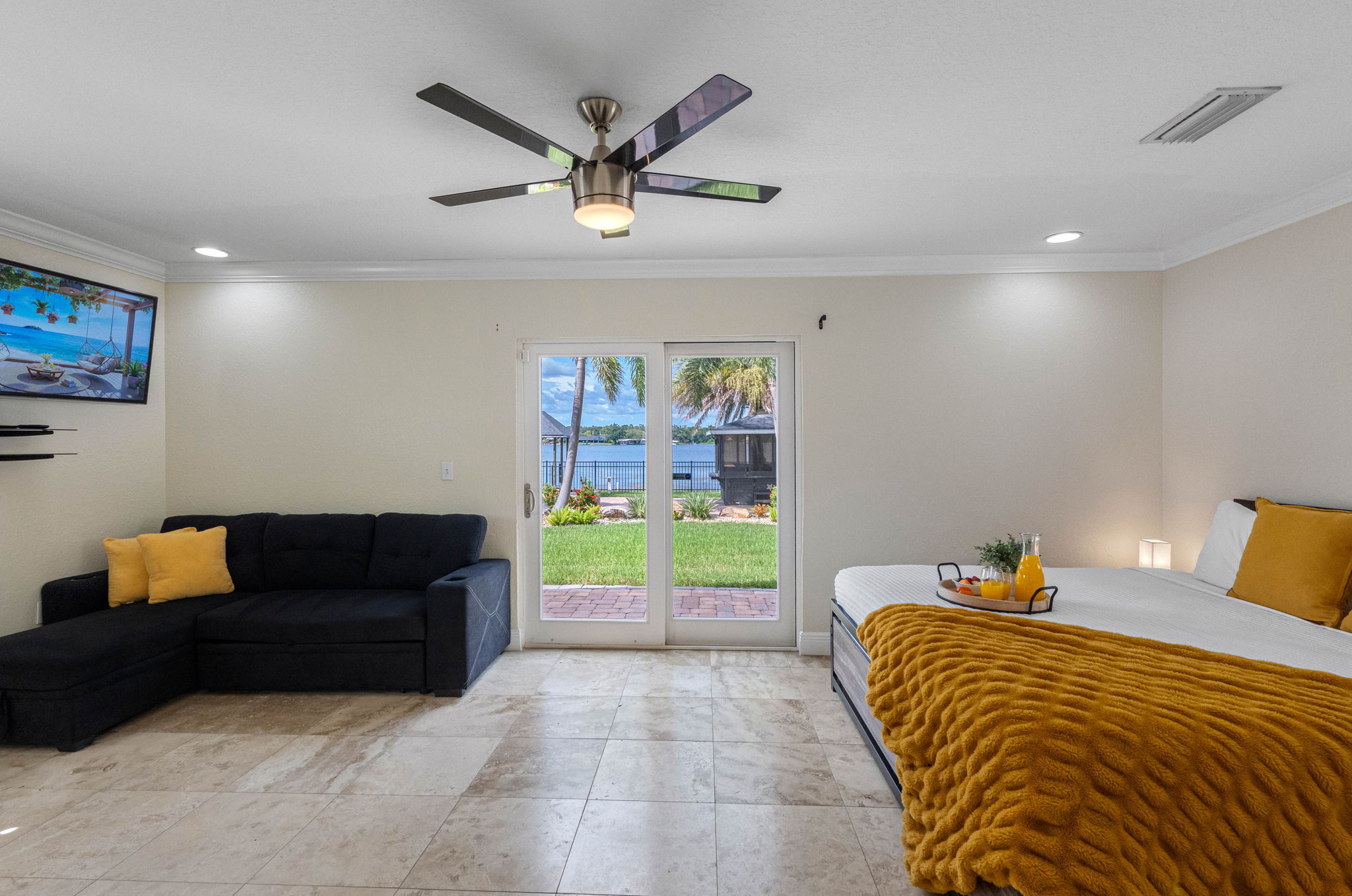 In addition to the king-sized bed, the room is equipped with a sleeper sofa/futon, offering a versatile option for extra sleeping arrangements.
