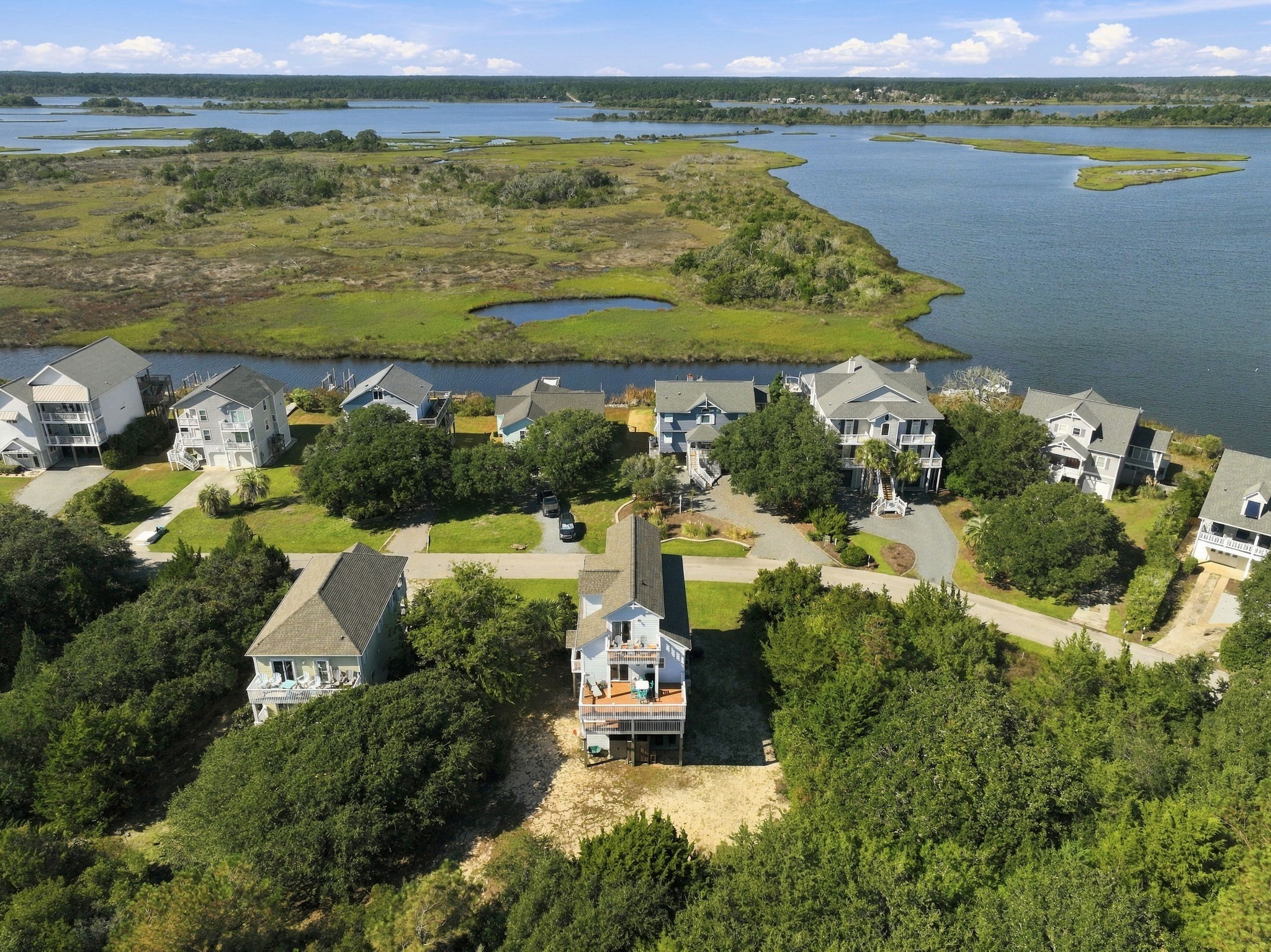 Stunning aerial views showcasing the surrounding coastal community, scenic marshlands, and waterways
