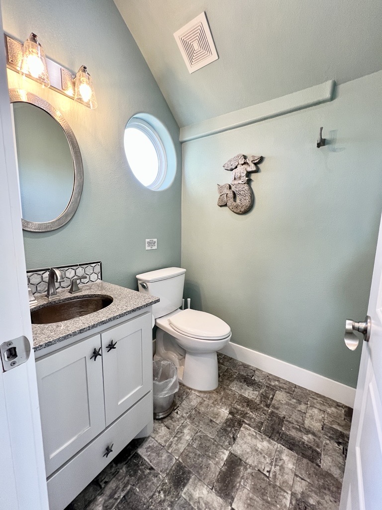 Crystal Paradise Bathroom 1: Guest-ready powder room combining style and practicality.