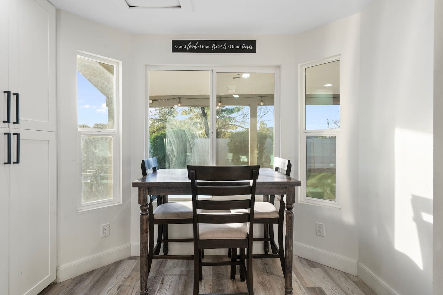 Bright dining area with expansive glass windows.
