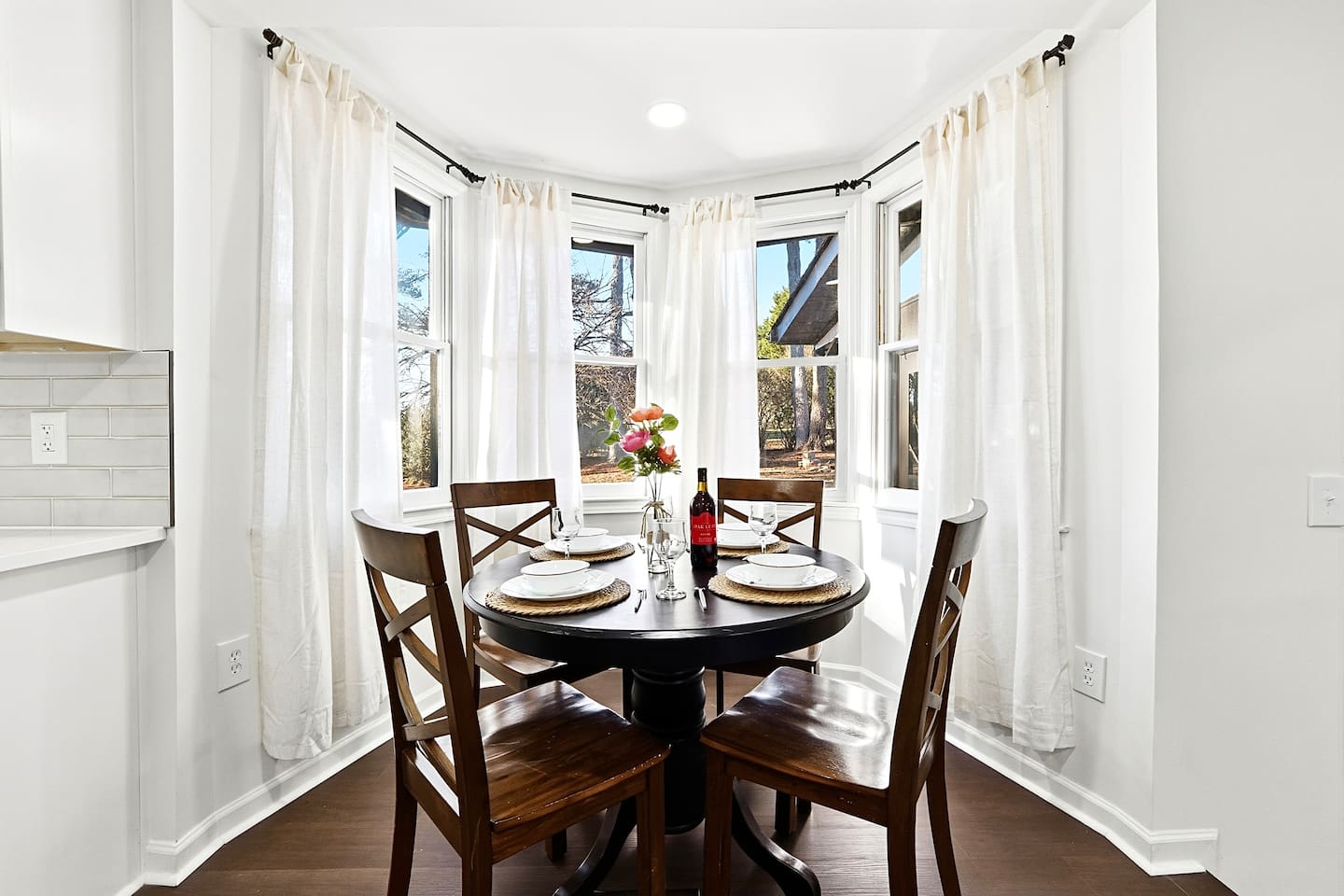 Charming kitchen-side breakfast nook with seating for four. A cozy spot for coffee, breakfast, or casual conversations with family and friends.