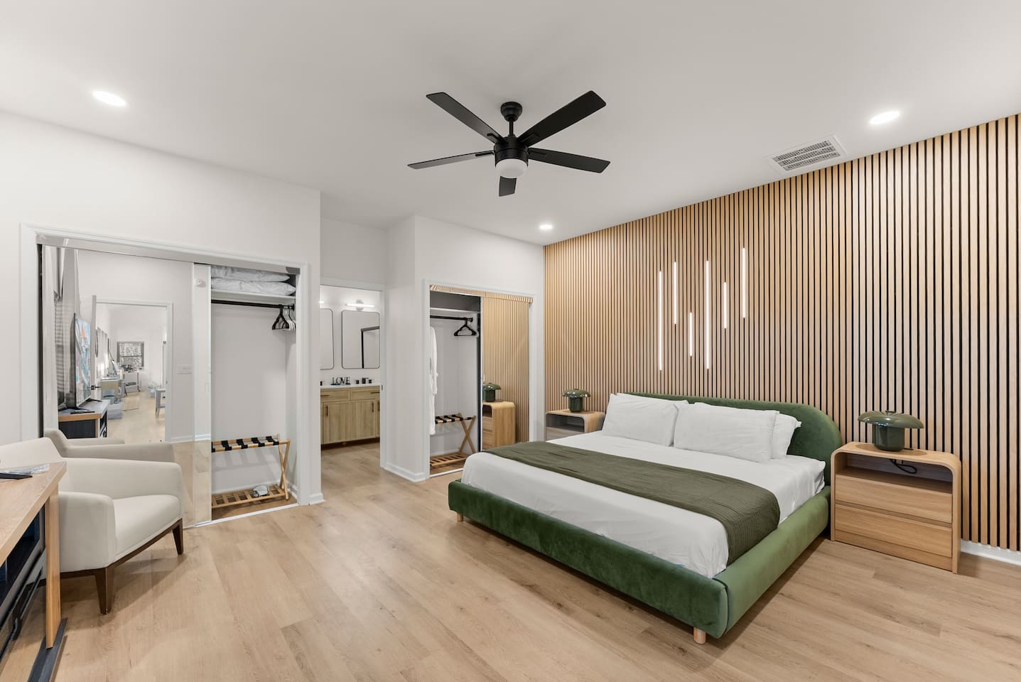 Spacious master bedroom with a king bed, cozy electric fireplace, and a private en-suite bathroom—your perfect retreat.”
