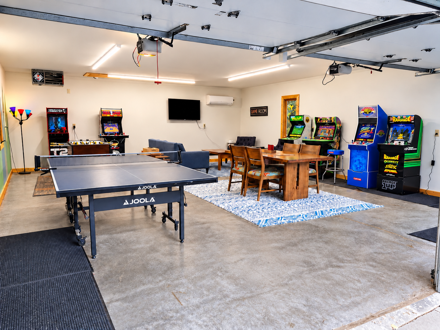 Enjoy the heated game garage with six arcade games, ping-pong, foosball, a TV and couch, plus a table for cards and board games.