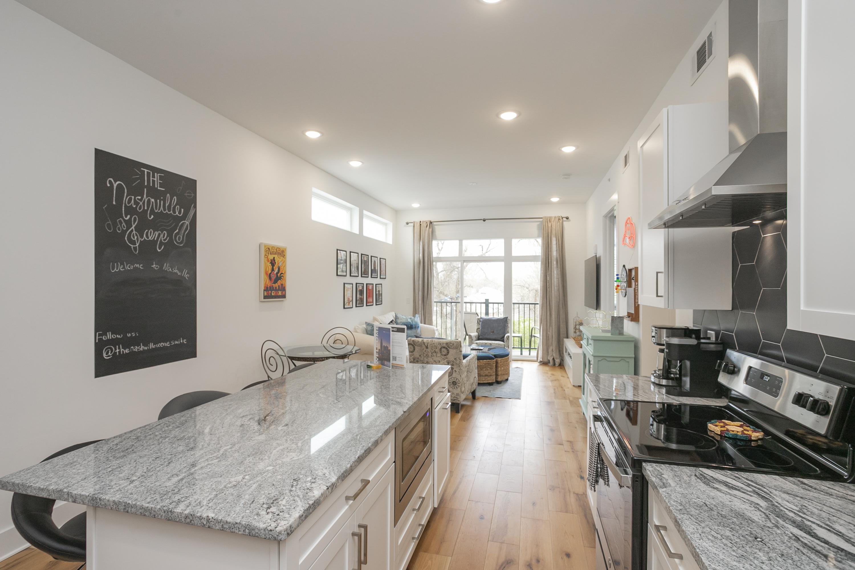 Plenty of room to enjoy charcuterie and dining at this large bar area in the kitchen