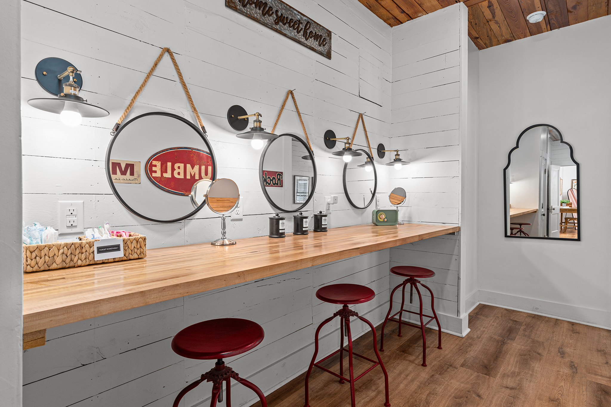 Get ready in style - this spacious vanity area features three mirrors and plenty of room for your group to get ready together. 