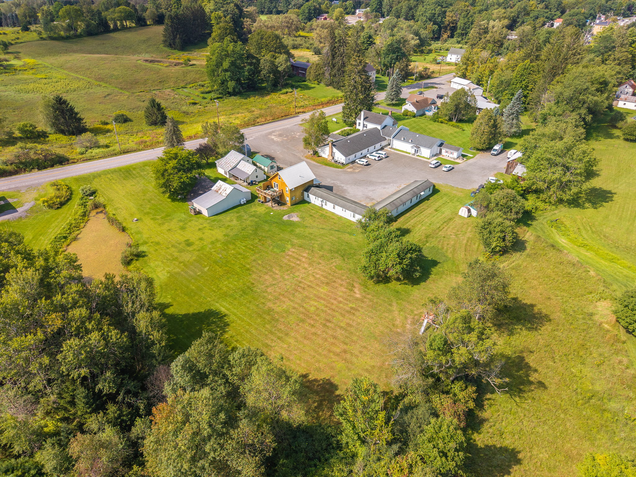 The 1825 rentals sit amid spacious lawns and a scenic country landscape.