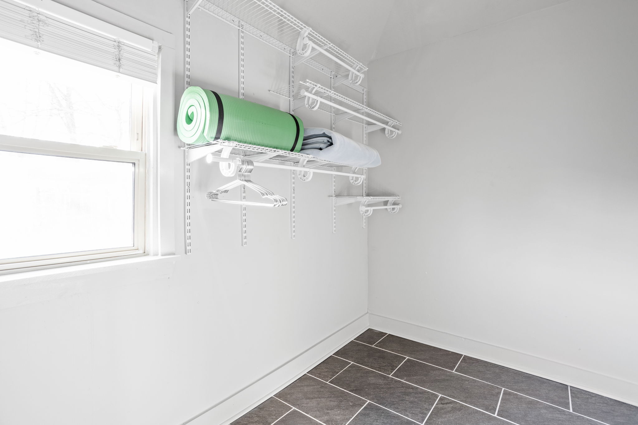 Store your belongings and clothes in the expansive primary bedroom closet.