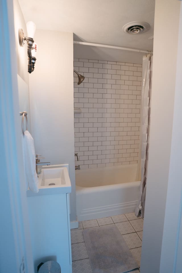 Full Bathroom, bathtub, mirror & sink & a toilet. Simple, clean, and comfortable for a refreshing start to your day.
