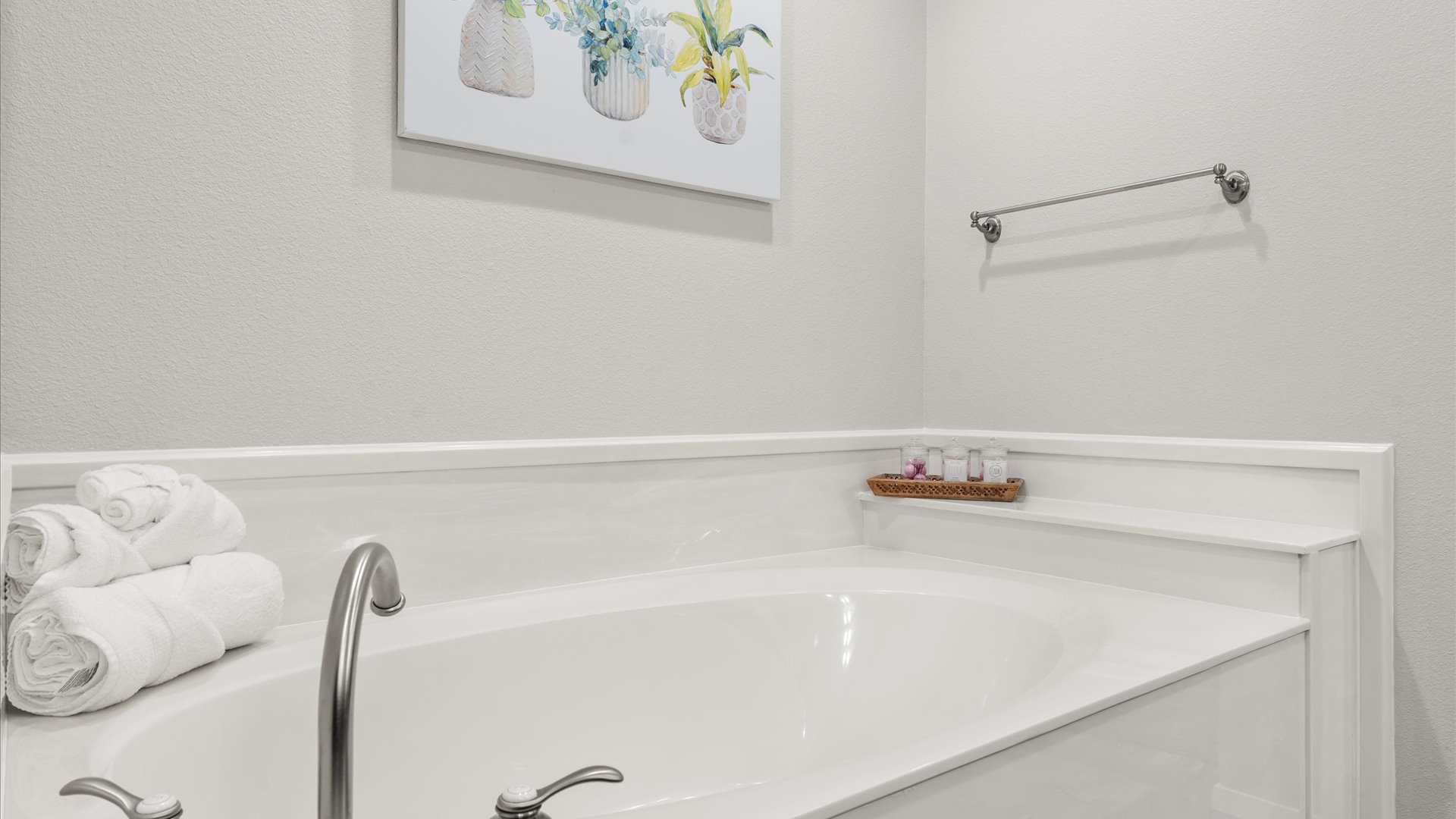 King 1 bathroom with large soaker tub, perfect for a relaxing spa-like bath experience. Large walk in shower. Unwind in comfort and enjoy the serene ambiance of this luxurious bathroom feature