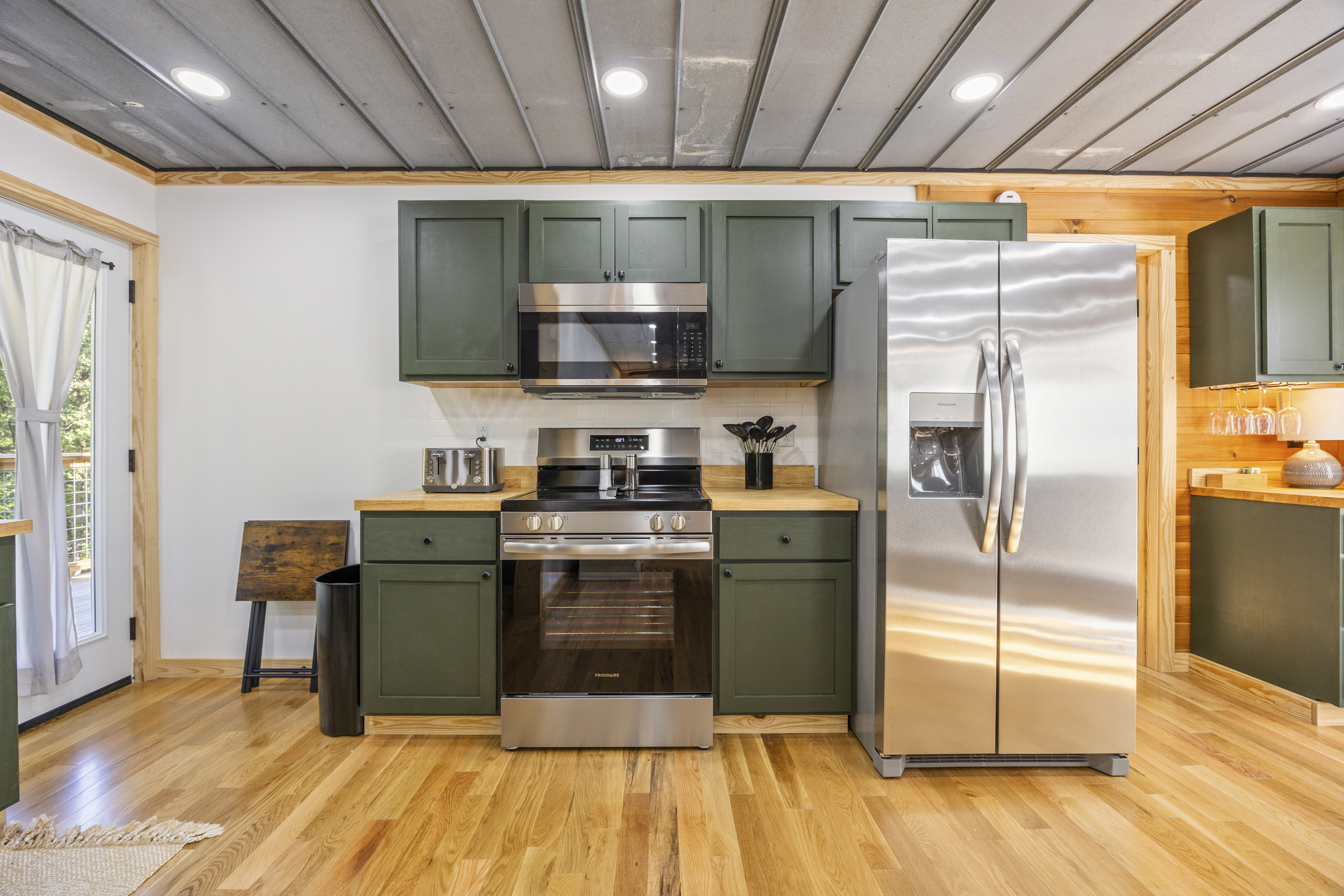 Fully equipped kitchen with stainless appliances, coffee maker, and everything you need for meals in.
