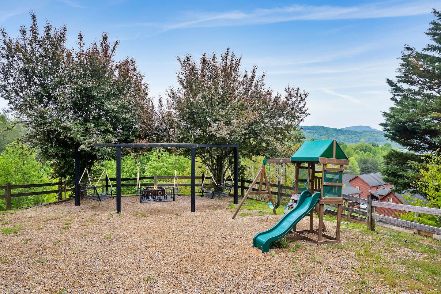 firepit - swing chairs and playset - fenced in area