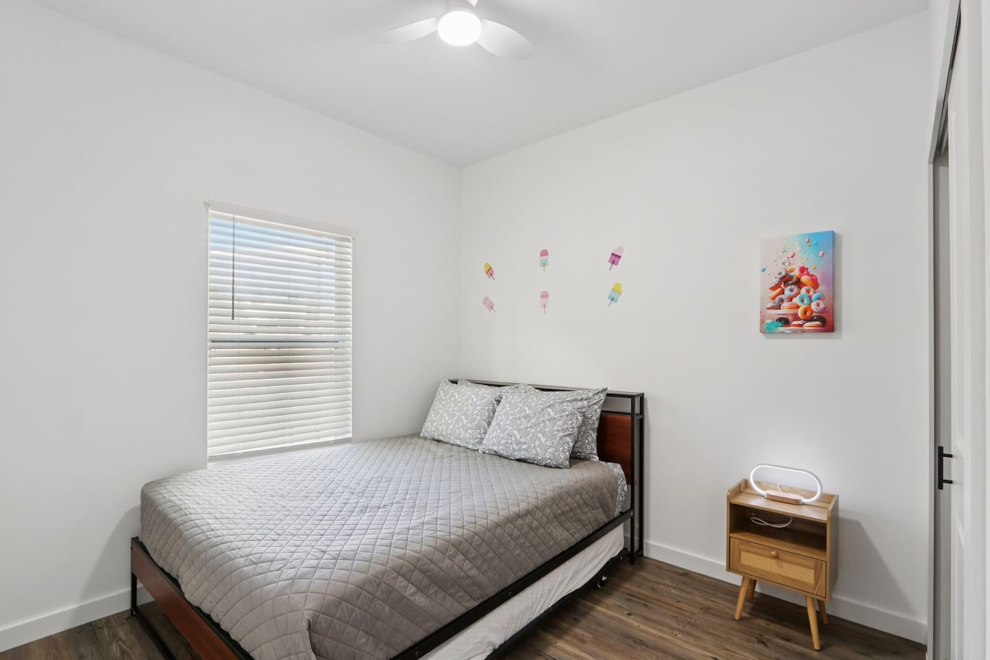 Bedroom has Queen Bed, twin trundle under bed, nightstand, suitcase holder, closet with hangers