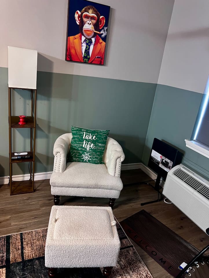 Accent chair with matching ottoman for a small spot to sit back and relax.
