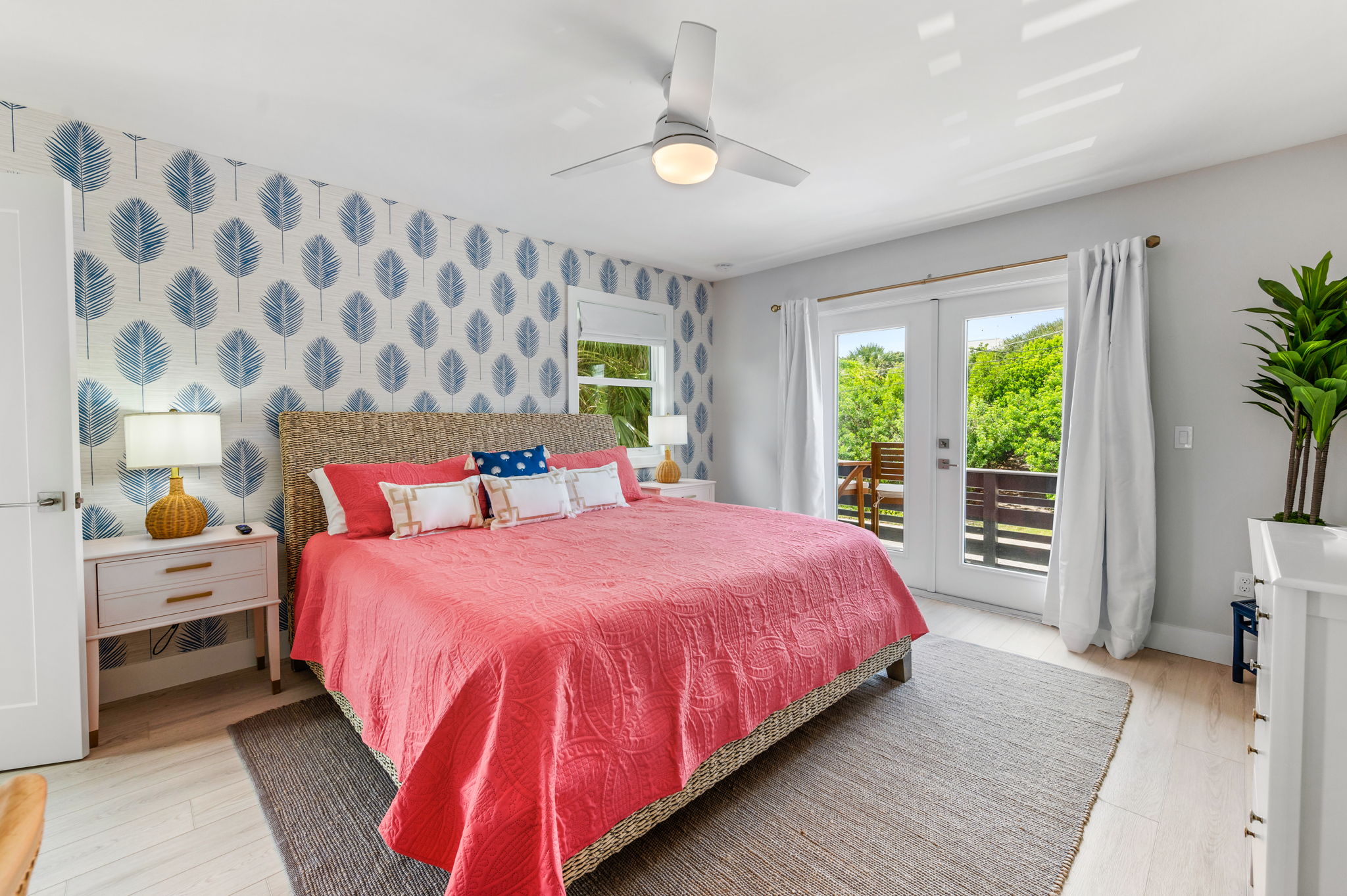 Escape to our upstairs master suite, complete with a sumptuous king bed, a large TV for your viewing pleasure, a sleek ensuite bathroom, and a convenient desk, plus an private outdoor balcony. Your perfect sanctuary awaits