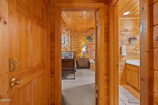 Downstairs hallway to bathroom and bedroom