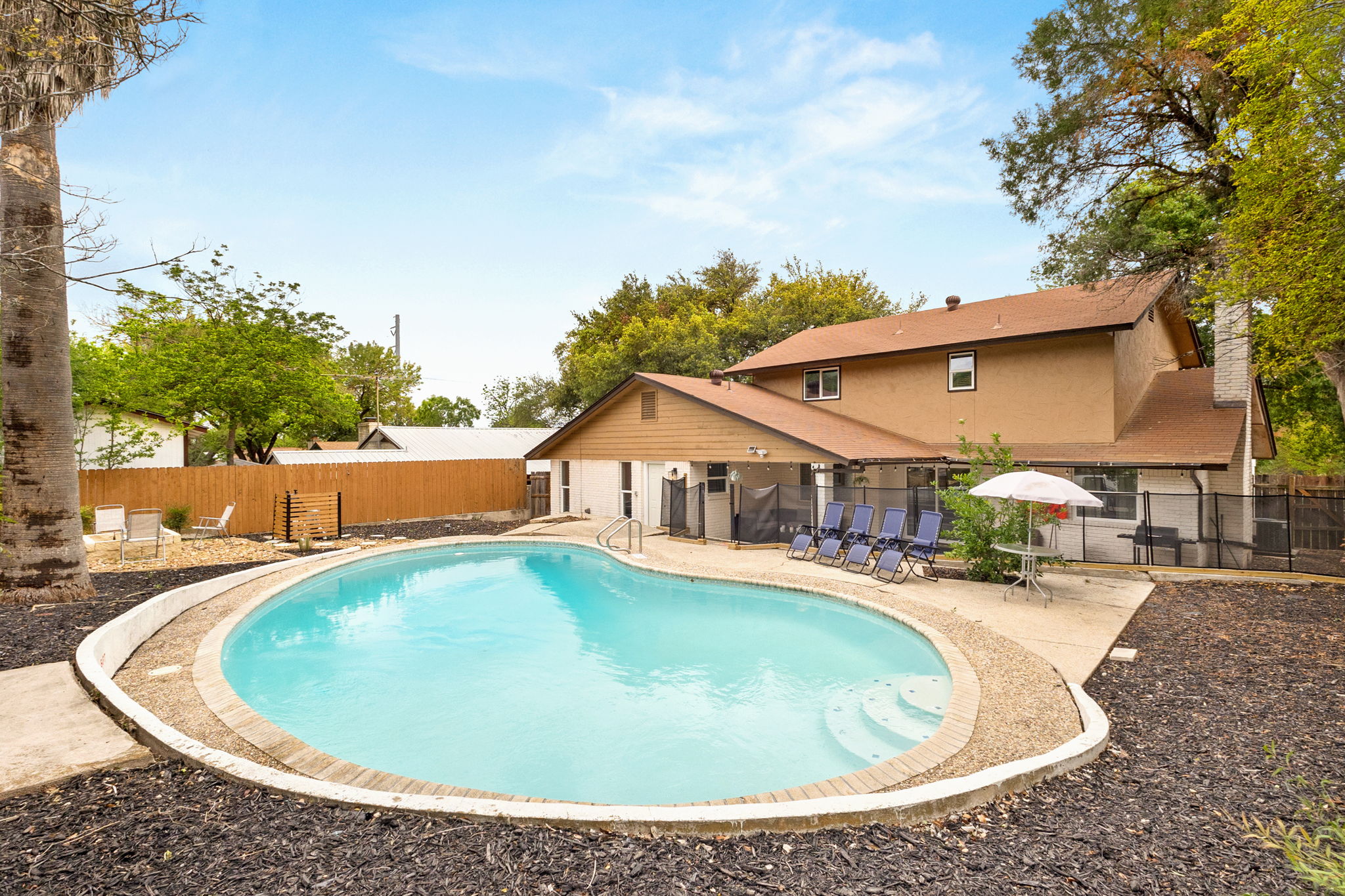 Spacious private pool with lounge chairs—perfect for sunny days ☀️💦
