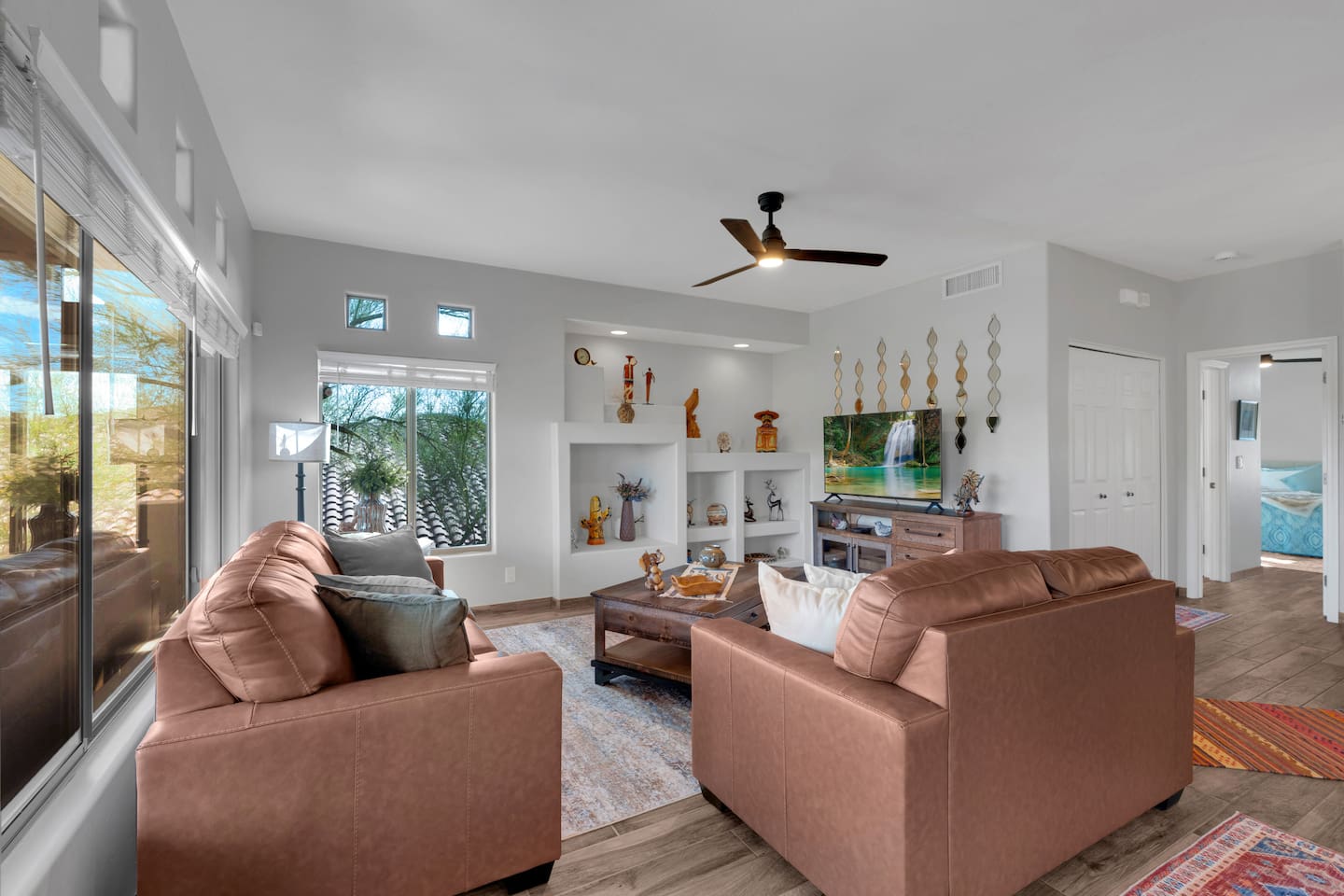 Spacious living room with leather sofas, smart-TV, coffee table