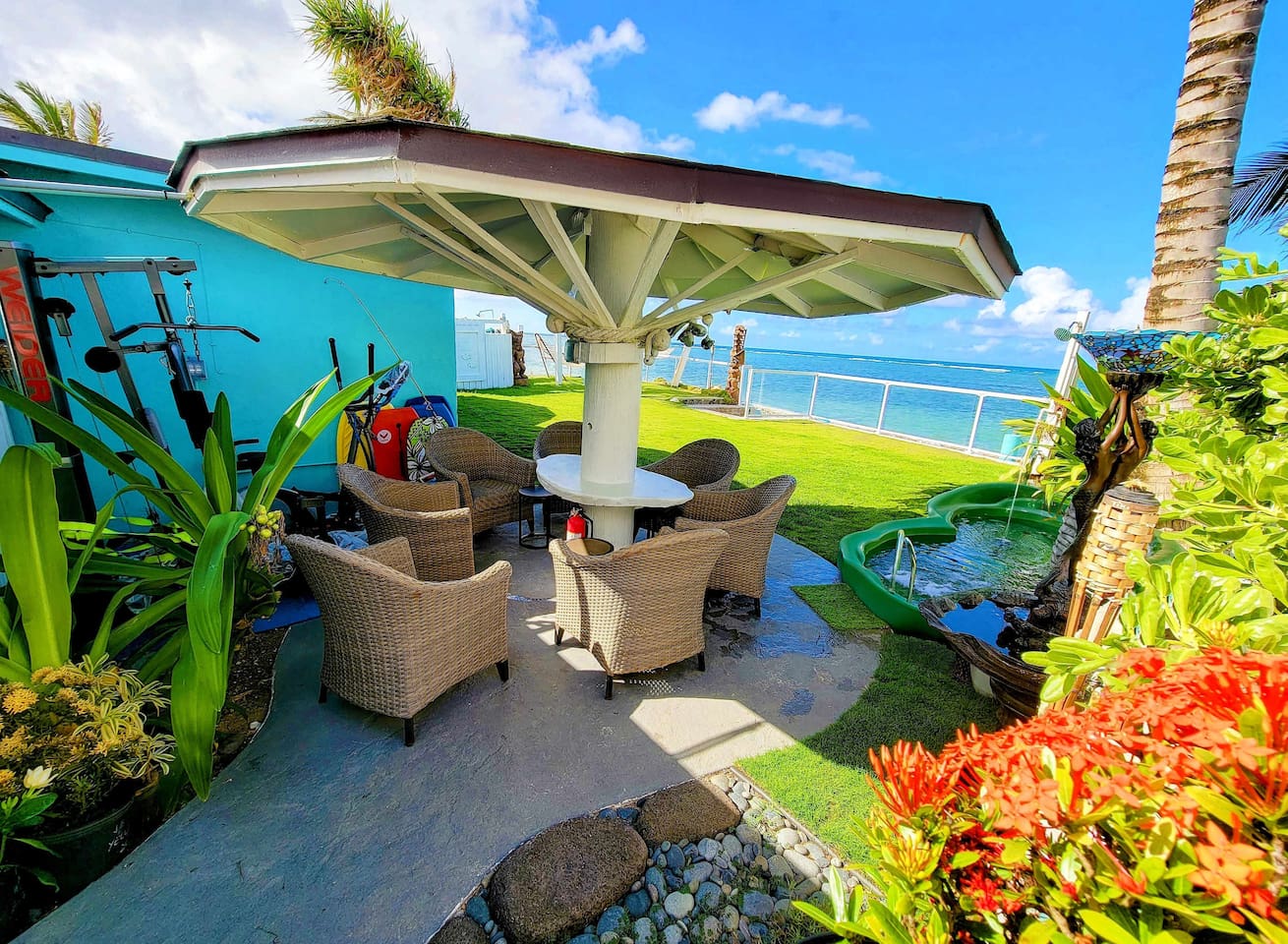 Beachfront Gazebo & Gym with electrical outlets in the center white pillar for your laptops and electronics.To the right is the 7-person beachfront jacuzzi with 2 outdoor showers and surround sound outdoor bluetooth tower speakers that are waterproo