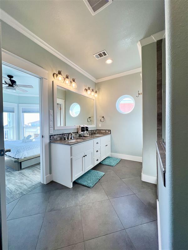 Crystal Paradise Bathroom 3: Stylish vanities with spacious countertops and well-lit mirrors make freshening up a breeze.