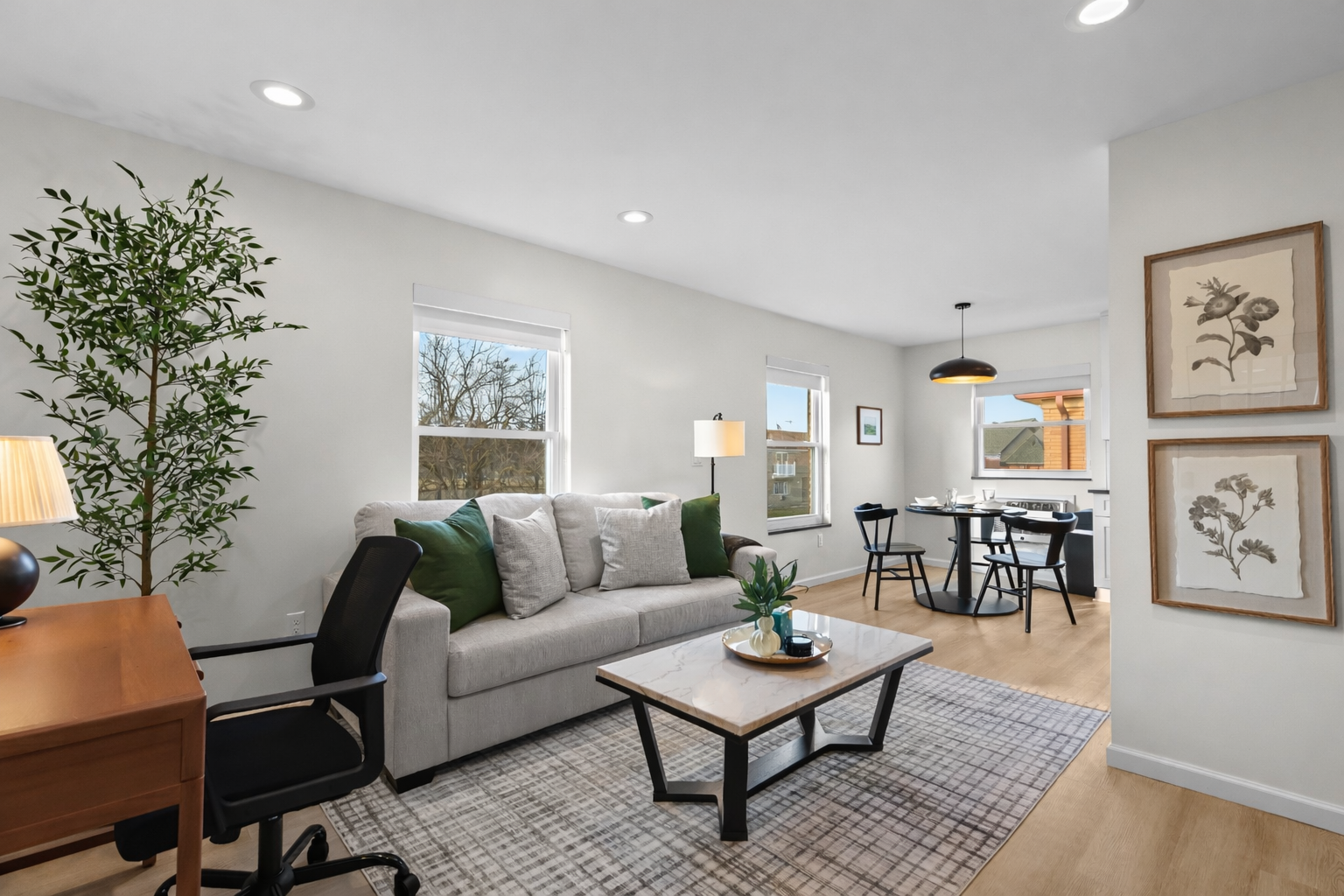 Spacious, light-filled living area with cozy seating, modern décor, and seamless flow to dining—perfect for relaxing, working, or hosting with ease.