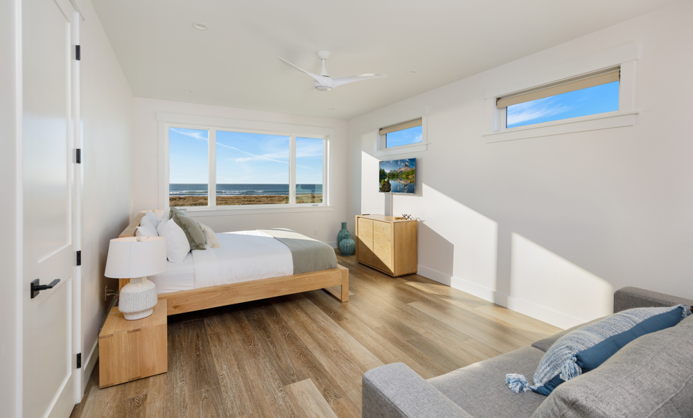 Upstairs primary bedroom with king bed & sofa bed