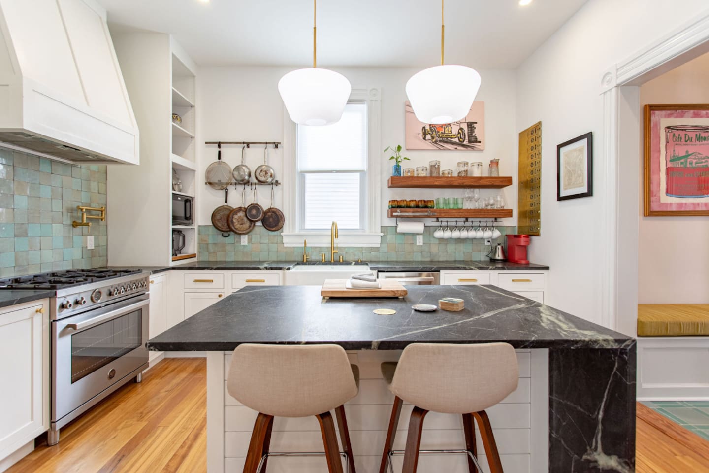 A complete view of the kitchen, featuring modern appliances, ample counter space, and stylish cabinetry, creating a functional and inviting cooking area.