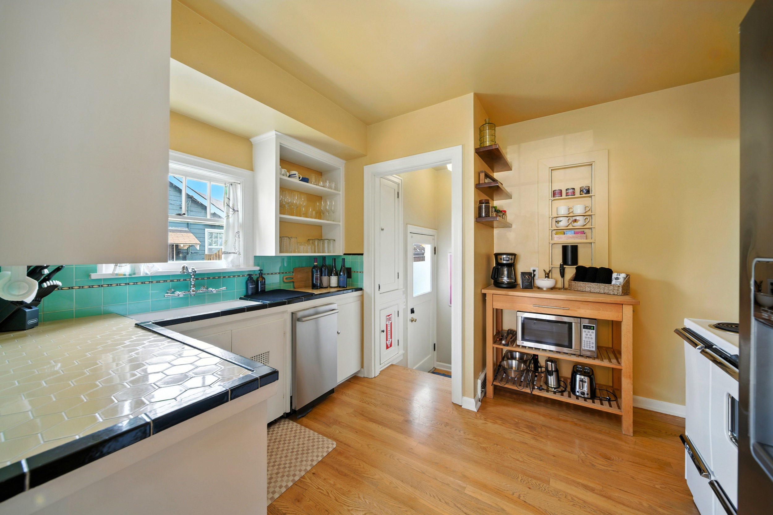 Charming, compact kitchen with a vintage, electric range.