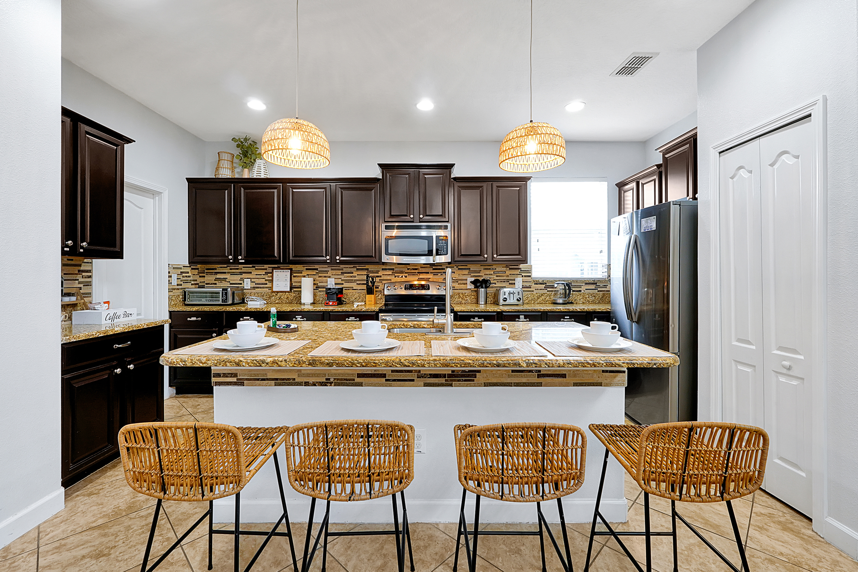Granite countertops on the background of a fully equipped kitchen with stainless steel appliances