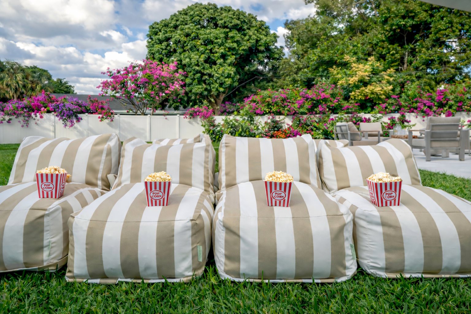 Movie nights under the stars with our outdoor cinema—plush lounge seating, popcorn ready, and your favorite shows streaming in total backyard privacy.